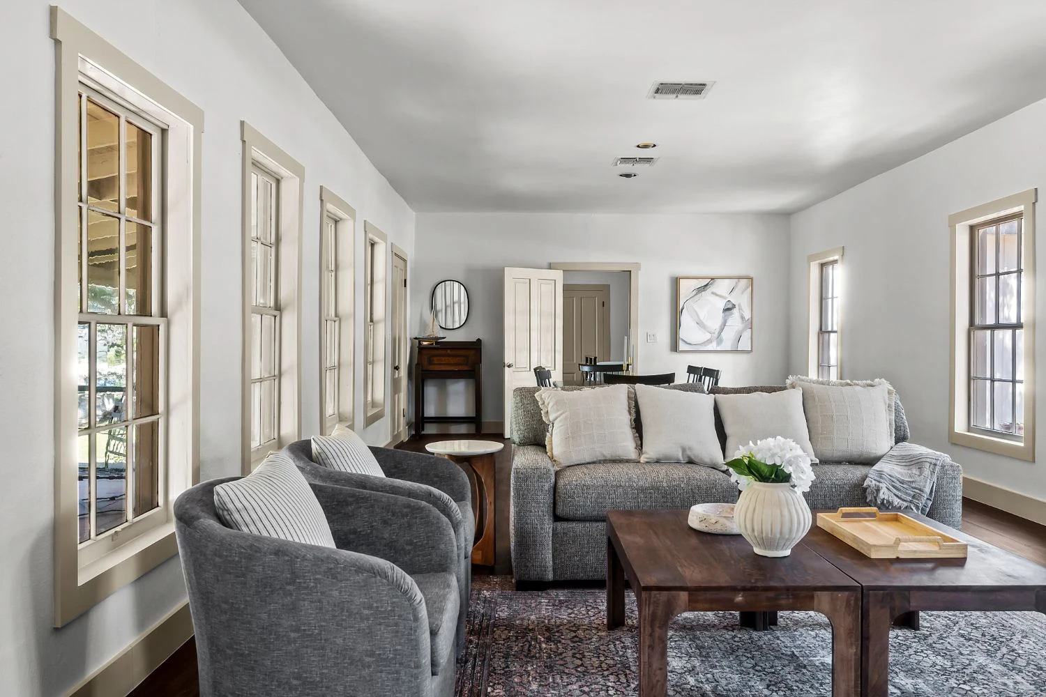The white living room, windows on three sides at Eck Lane, vacation rental in Austin, Texas