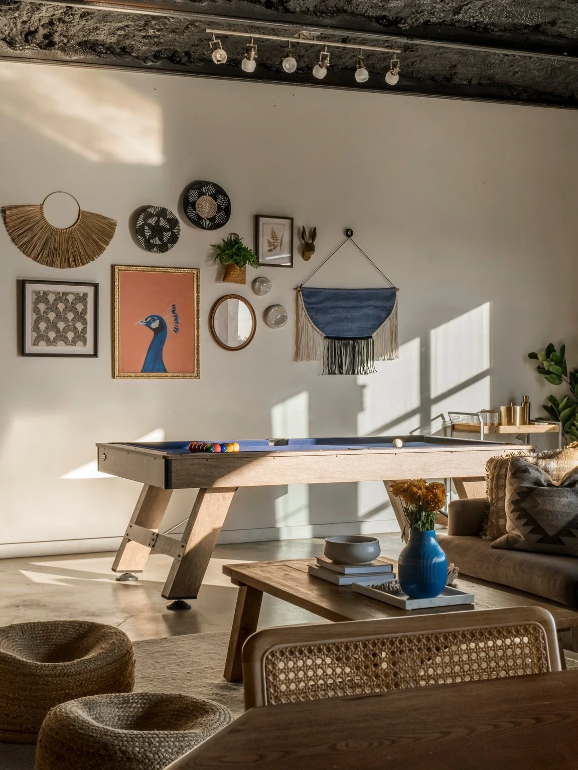 The gallery wall above the pool table at Juniper Ridge, vacation rental in Dripping Springs, Texas