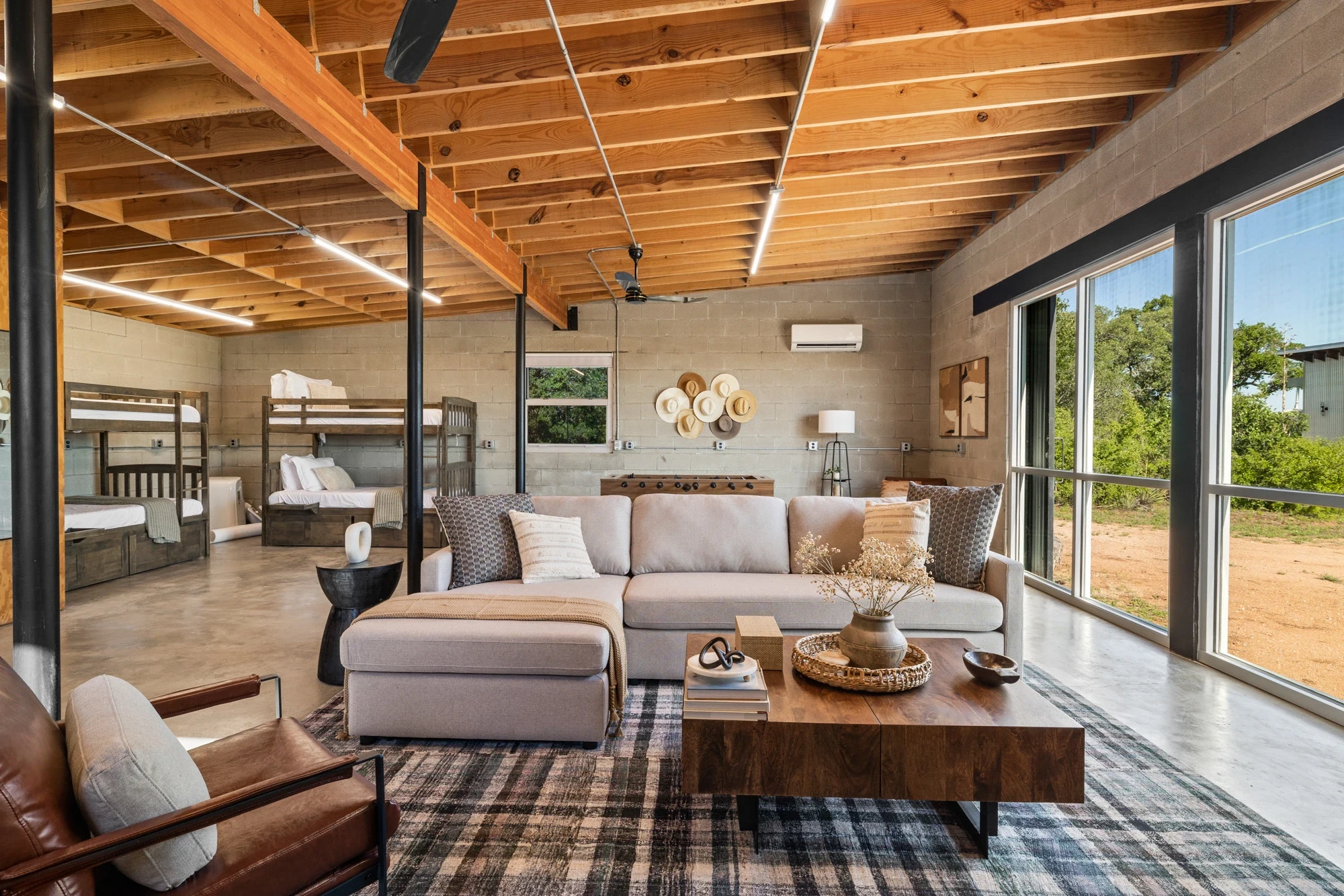 Great room & bunks under the pine framing at Lazo House, vacation rental in Llano, Texas