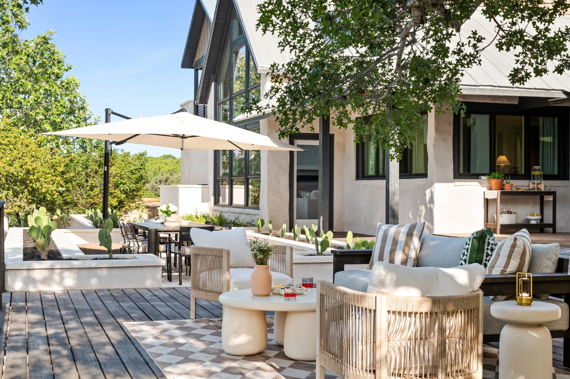The deck under the oaks, laid out for a long afternoon at Valley Ridge, vacation rental